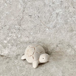 Load image into Gallery viewer, Handmade and hand painted cute white wood tortoise with black eyes and smile made by t-lab