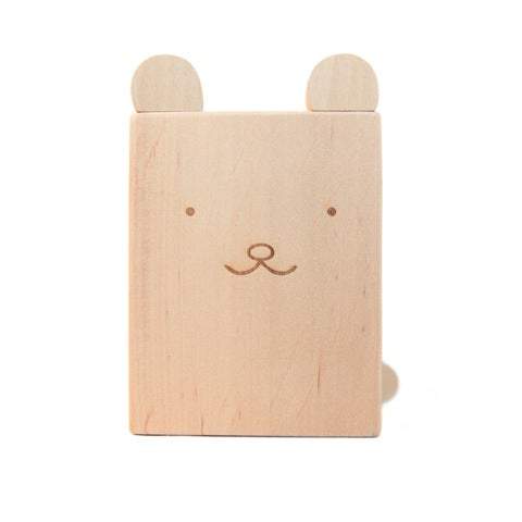 A cute bear pencil holder hand crafted and hand engraved in Europe. Made from solid alder wood, it’s the perfect wooden accessory. Painted eyes, nose and mouth on side of pencil holder to give it a cute bear face. 