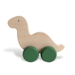 Load image into Gallery viewer, A cute push dinosaur with green wheels which has been handcrafted and hand-painted in Europe. Made from natural maple wood, it’s perfect for encouraging imaginative play with little ones. Ideal for small hands to hold, it aids in the development of fine motor skills.
