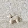 cute white wooden toy poodle toy with black eyes, nose and collar. Finely crafted by t-lab